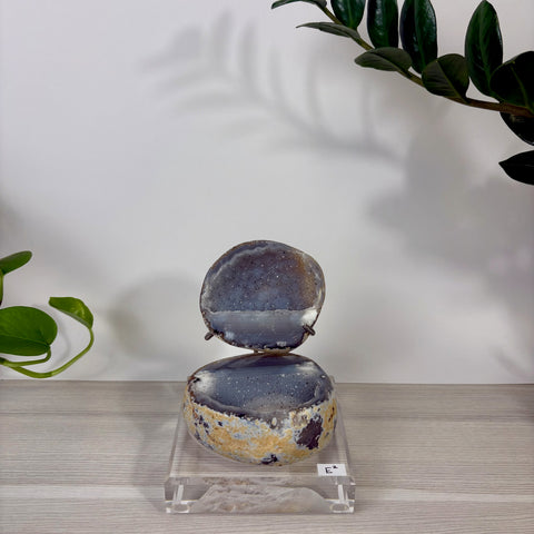 Druzy mermaid box with a purple agate geode lid and base on a clear acrylic stand.