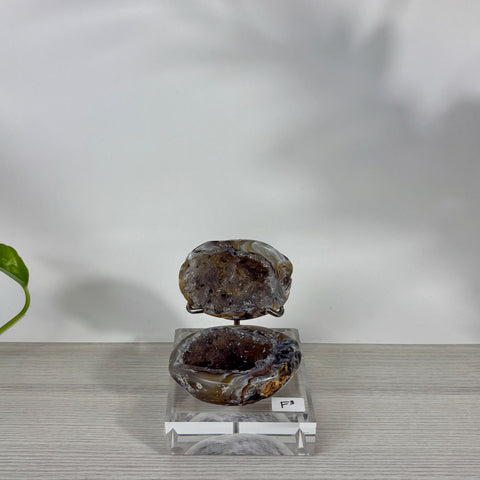 Druzy mermaid box featuring a split agate geode with sparkling dark crystals on a clear acrylic display stand.
