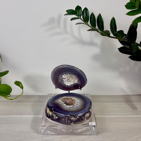 Dark purple agate druzy mermaid box with a sparkling crystal geode center, displayed on a clear acrylic stand.