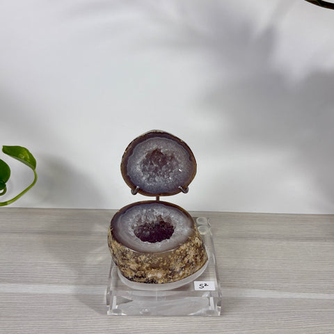 Druzy mermaid box geode with sparkling purple crystals, displayed open on a clear acrylic stand labeled S2.