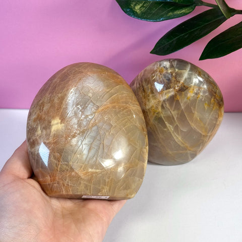 Peach Moonstone free form crystal, showing its natural peachy-orange and brown hues with internal fractures.