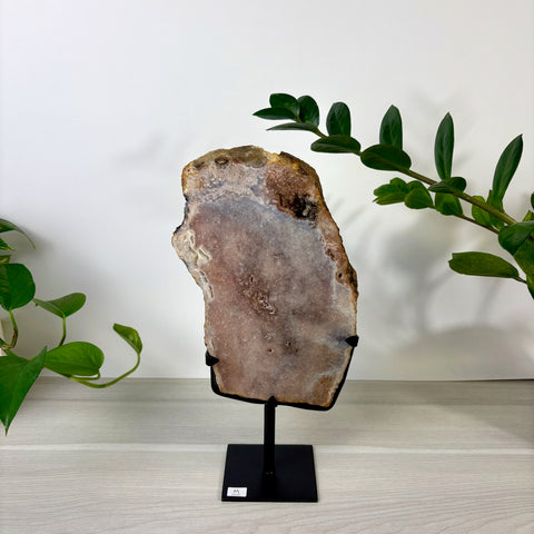 Pink amethyst slab with crystalline texture on a black metal display stand, size M, set against a white background.