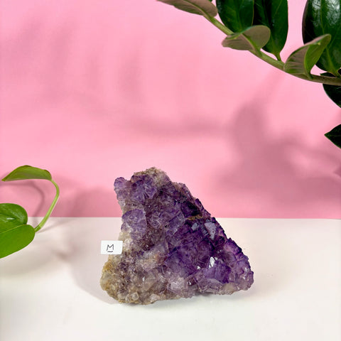 Statement purple Turkish fluorite crystal cluster, size M, featuring deep violet geometric cubes on a white surface.