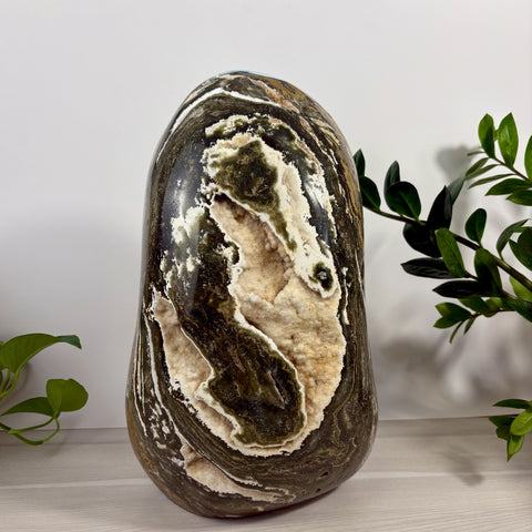 XXXL Sea Jasper free form stone with dark green, brown, and cream swirls featuring a textured, crystalline geode center.