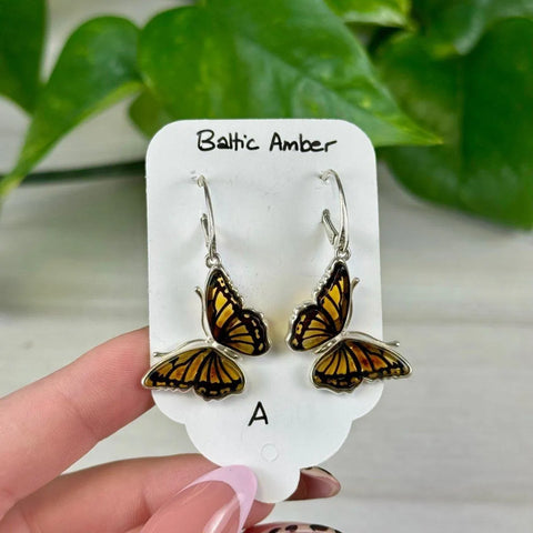 November collection: Dainty silver butterfly earrings with warm amber wings, perfect for fall.