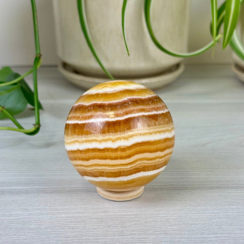 Candy Corn Calcite Sphere 55 3 - Kenna's Crystals from TikTok