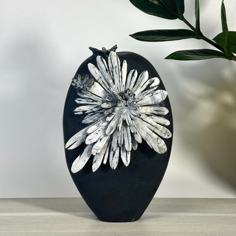Black Chrysanthemum Stone Free Form with white floral pattern.