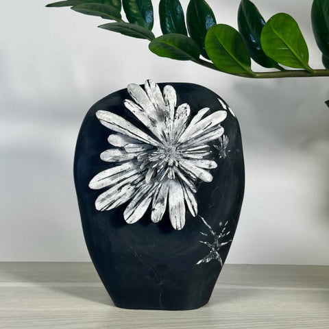 Black Chrysanthemum Stone free form with white crystal flower pattern.