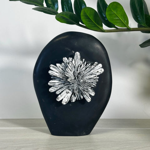 Black chrysanthemum stone free form with white crystal flower pattern.