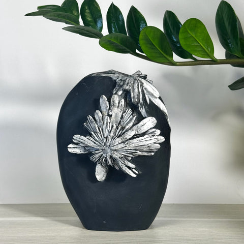 Black chrysanthemum stone free form with white crystal flower formations.