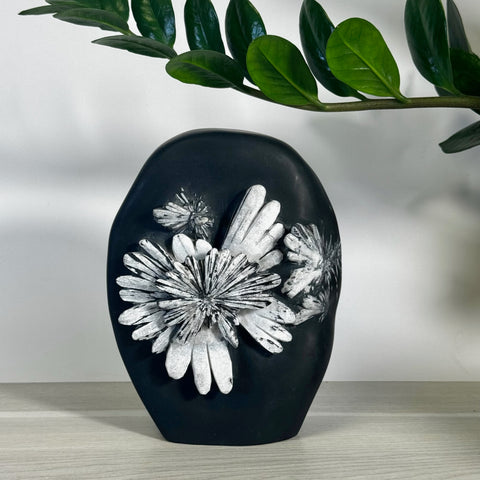Black chrysanthemum stone free form with white floral patterns, small size.