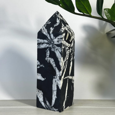 Black and white Chrysanthemum Stone Tower with natural floral patterns.