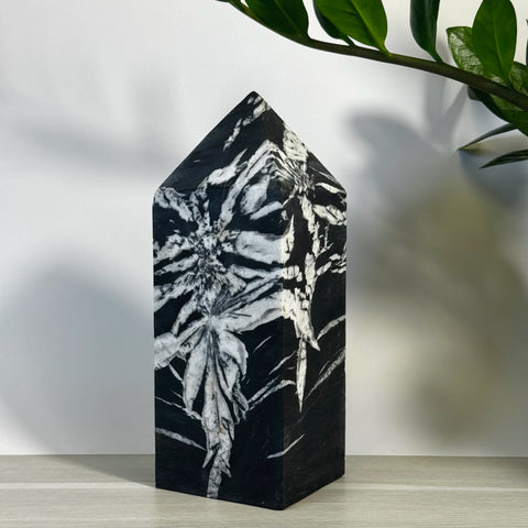 Imperfect black and white Chrysanthemum Stone Tower with unique floral patterns.
