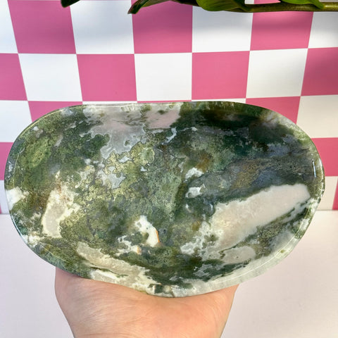 Curvy moss agate bowl with natural green, white, and brown patterns.