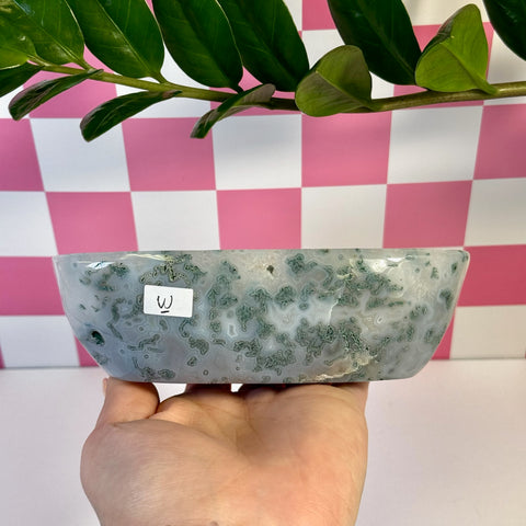 Curvy moss agate bowl, variant W, held in hand, showing green and white natural patterns.