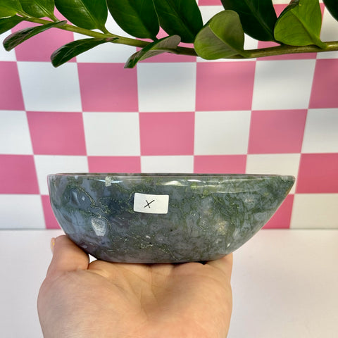 Curvy Moss Agate Bowl held in hand, showcasing its natural green and white patterns.
