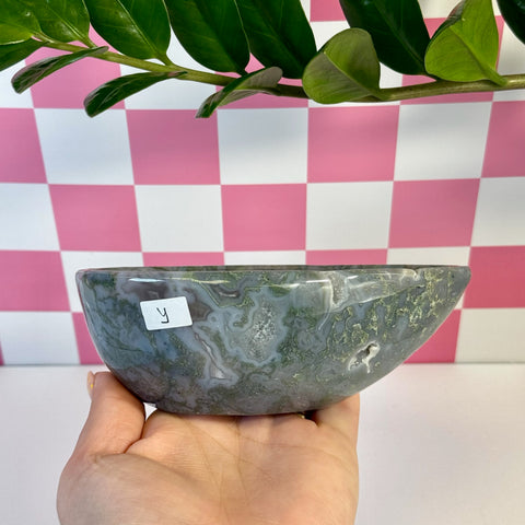 Curvy moss agate bowl, variant Y, with natural green and white patterns, held in hand.