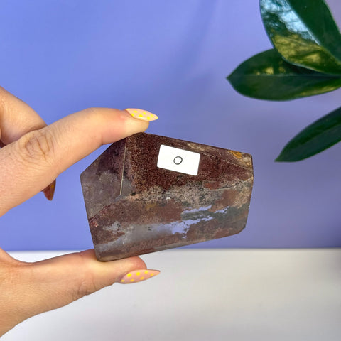 Garden Quartz Free Form, variant O, with deep reddish-brown hues and white mineral inclusions.