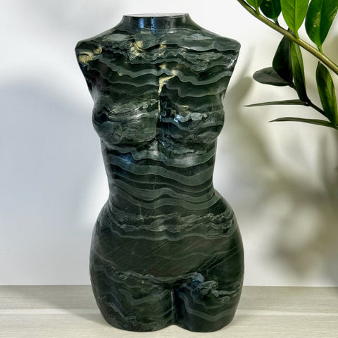 Green banded goddess body sculpture with natural wavy patterns.