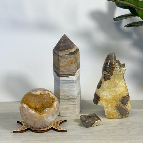 Kenna's Heart "Broken" Bundles: geode sphere, striped tower, and bear-shaped crystal with small heart.