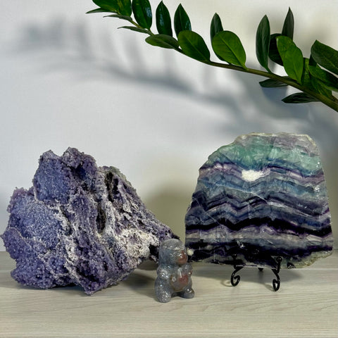 Kenna's Stylized Imperfect Bundle B: Large purple botryoidal chalcedony, a colorful fluorite slab on a stand, and a small gray crystal bear.