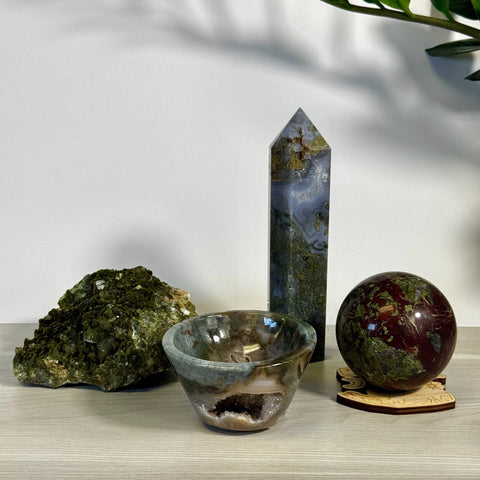 Kenna's Stylized Imperfect Bundle: green crystal cluster, moss agate tower, crystal bowl, and dragon's blood jasper sphere.