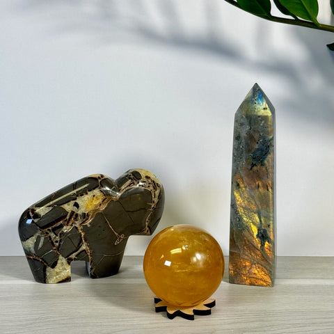 Kenna's Stylized Imperfect Bundle: dark brown crystal buffalo, golden citrine sphere, iridescent labradorite tower.