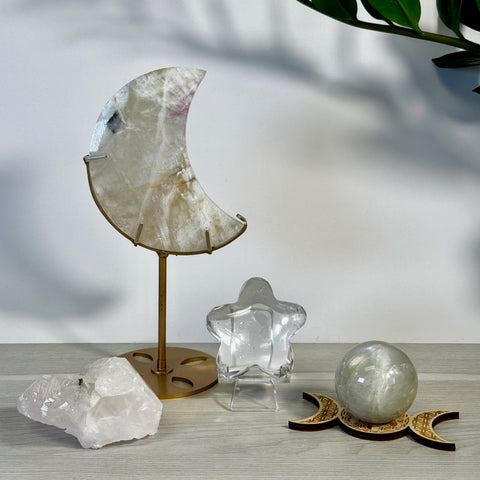 Kenna's Stylized Imperfect Bundle: Clear quartz moon on gold stand, star, sphere on triple moon wood stand, and raw crystals.