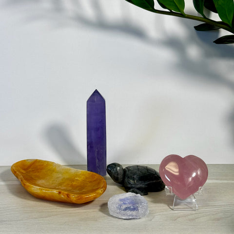 Kenna's Stylized Imperfect Bundle: purple tower, pink heart, black turtle, yellow dish, and clear crystal.