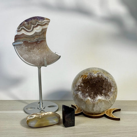 Kenna's Stylized Imperfect Bundle: Moon-shaped agate, geode sphere, polished stone, and black crystal.