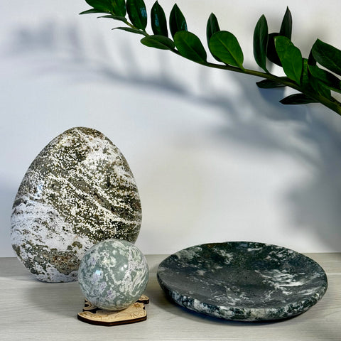 Kenna's Stylized Imperfect Bundle S: Green and white speckled crystal egg, sphere on wood stand, and dish.