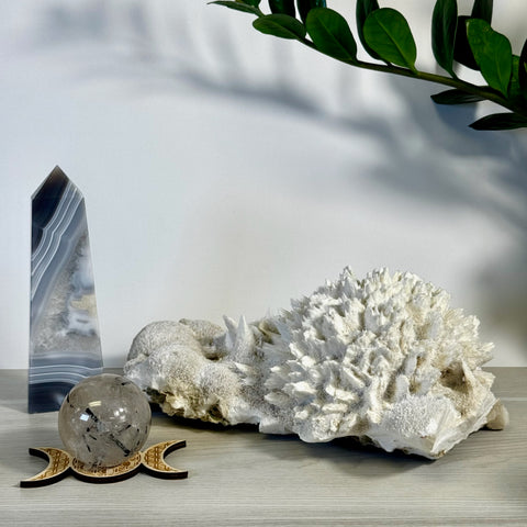 Kenna's Stylized Imperfect Bundle: Gray agate tower, clear crystal sphere on a triple moon stand, and white crystal clusters.