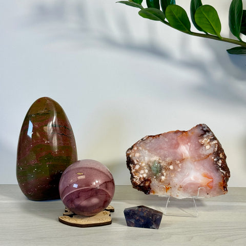 Kenna's Stylized Imperfect Bundle: Polished red and green crystal egg, pink orb, and a pink, white, and brown crystal slice.