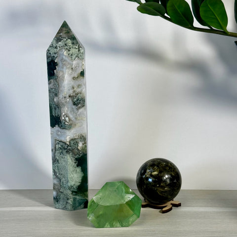 Kenna's Stylized Imperfect Bundle with tall green moss agate tower, faceted green fluorite, and dark green crystal sphere.
