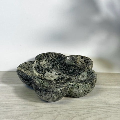 Kiwi fossil flower plate, dark green and black mottled stone, clover-shaped dish.
