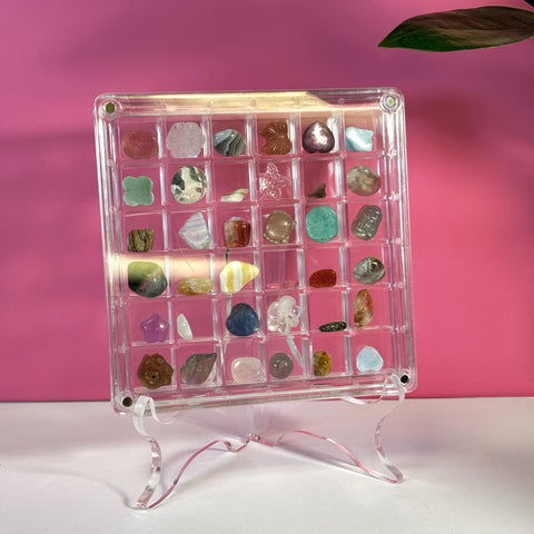 Clear acrylic mini display box with 36 compartments on a matching stand, filled with colorful polished stones.