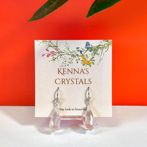 Vogel Rose Quartz earrings with faceted clear pink crystals and silver hooks on a floral card.