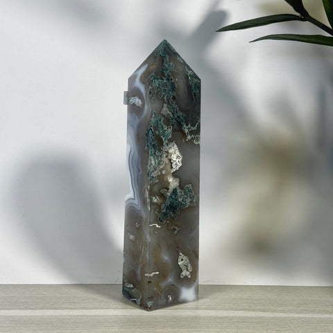 Tall, polished moss agate tower with white, gray, and deep green natural patterns.