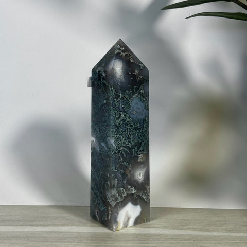 Tall, polished moss agate tower with dark green, white, and gray natural patterns, featuring a pointed top.