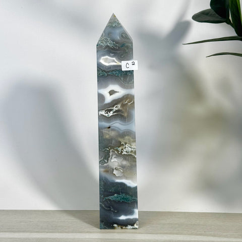 Tall, polished moss agate tower (C2) with striking grey, white, and green natural patterns.