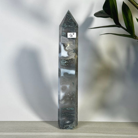 Tall, polished moss agate tower (G2) with natural grey, white, and green patterns, pointed top.