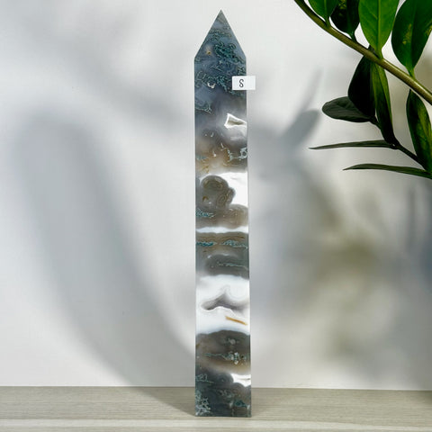 Tall, polished moss agate tower (variant S) with intricate green, white, and gray patterns.