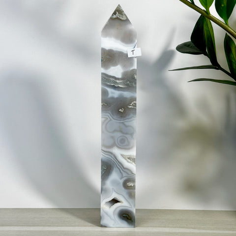 Tall, polished moss agate tower (variant T) with striking gray, white, and clear swirling patterns.