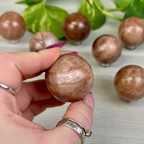 Sunstone In Peach Moonstone Sphere 55 1 - Kenna's Crystals from TikTok