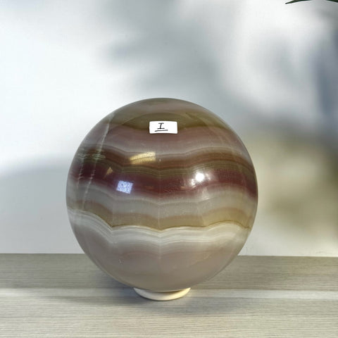 XL Pink Banded Onyx Sphere with natural pink, brown, and cream bands.